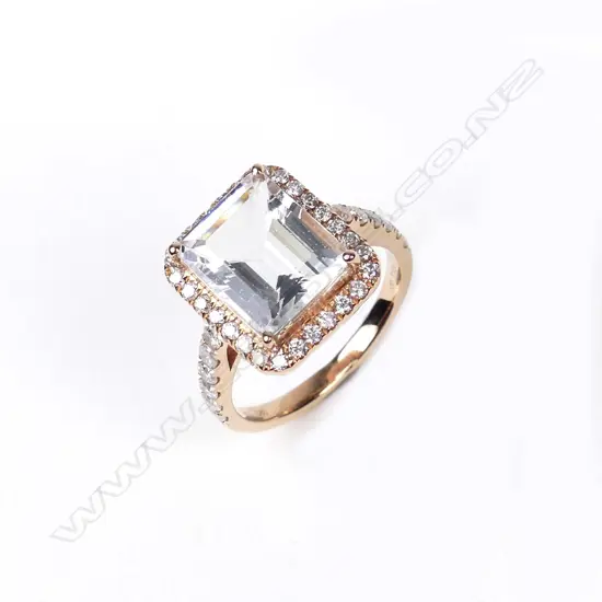 A 14ct rose gold aquamarine and diamond ring