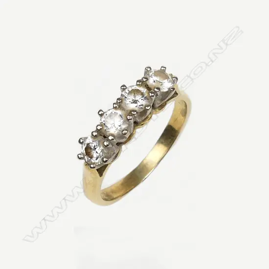 An 18ct gold and four stone diamond ring