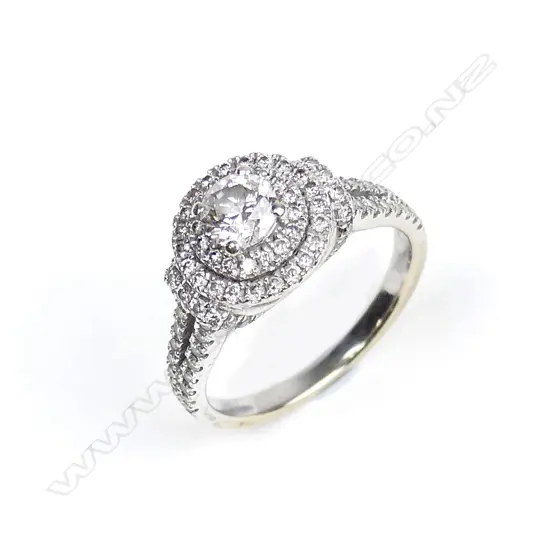 A 14ct. white gold and diamond cluster ring