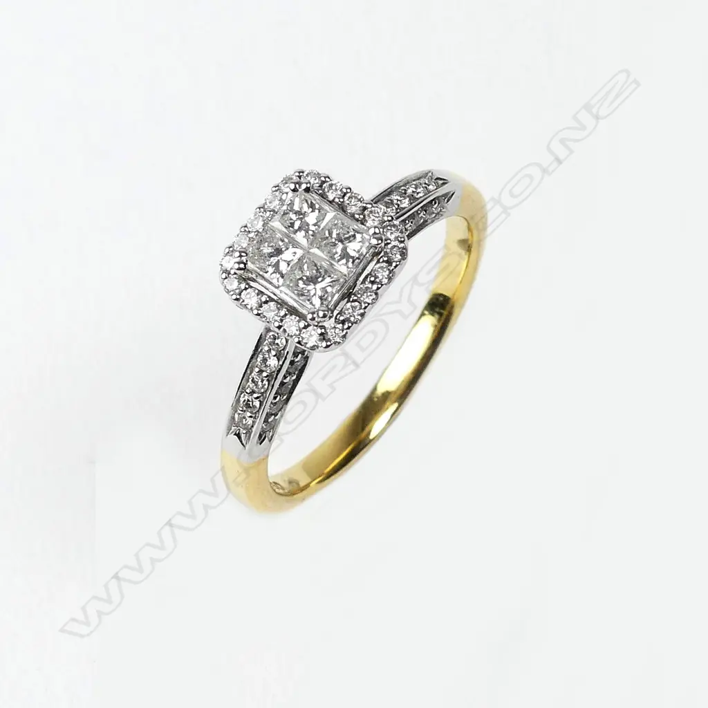 An 18ct gold and diamond cluster ring Image 1++