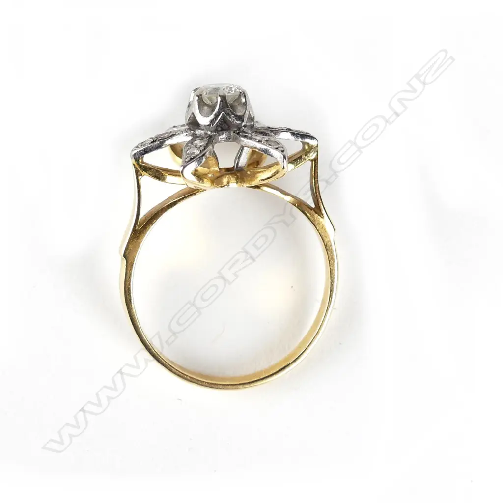An 18ct gold and diamond ring Image 1++