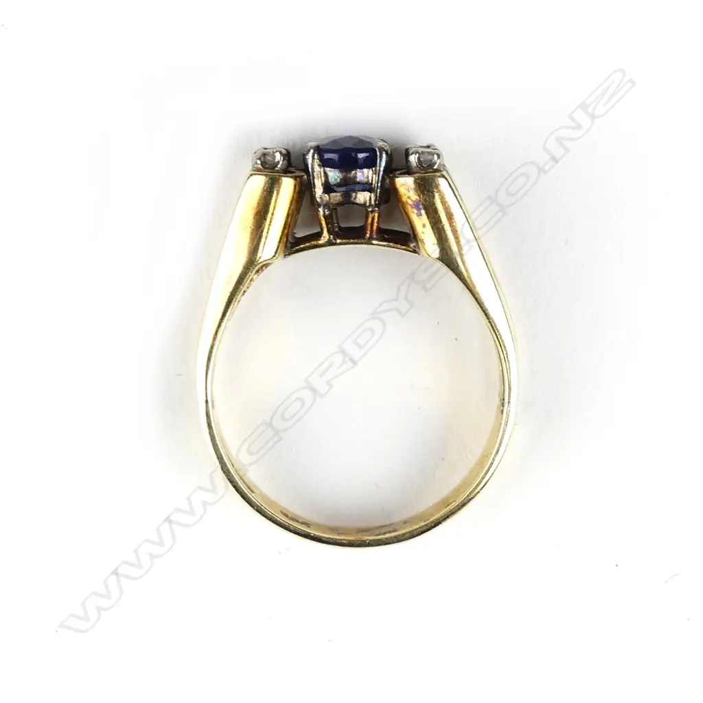 A 14ct gold sapphire and diamond ring Image 1++