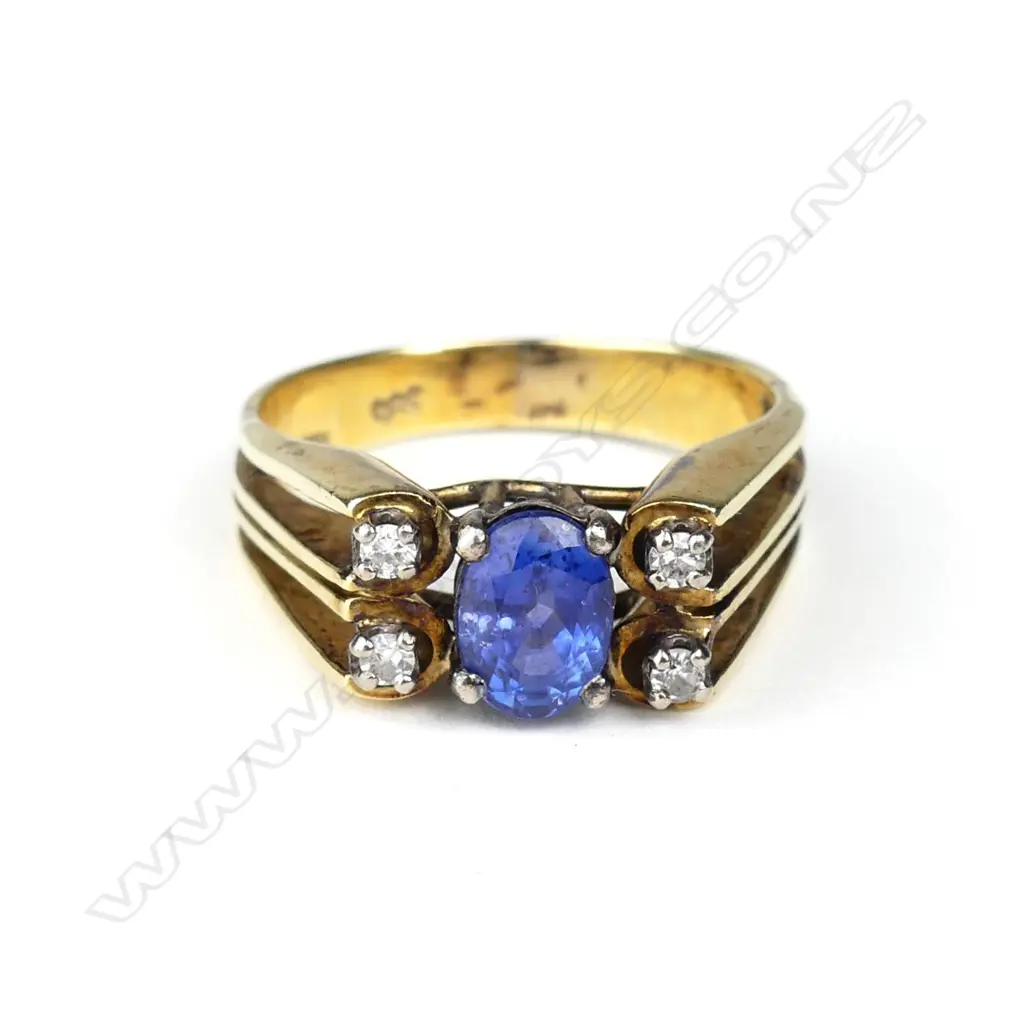 A 14ct gold sapphire and diamond ring Image 1++