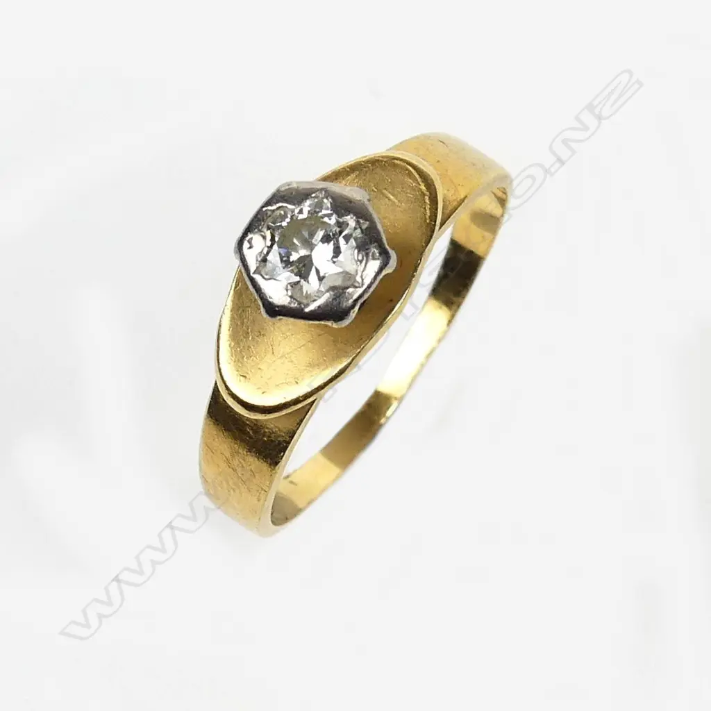 An 18ct. yellow gold and diamond solitaire ring Image 1++