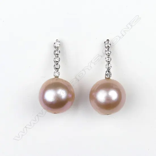A pair of 14ct white gold pearl and diamond earrings