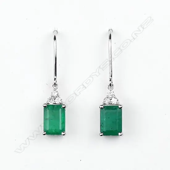 A pair of 14ct white gold emerald and diamond earrings