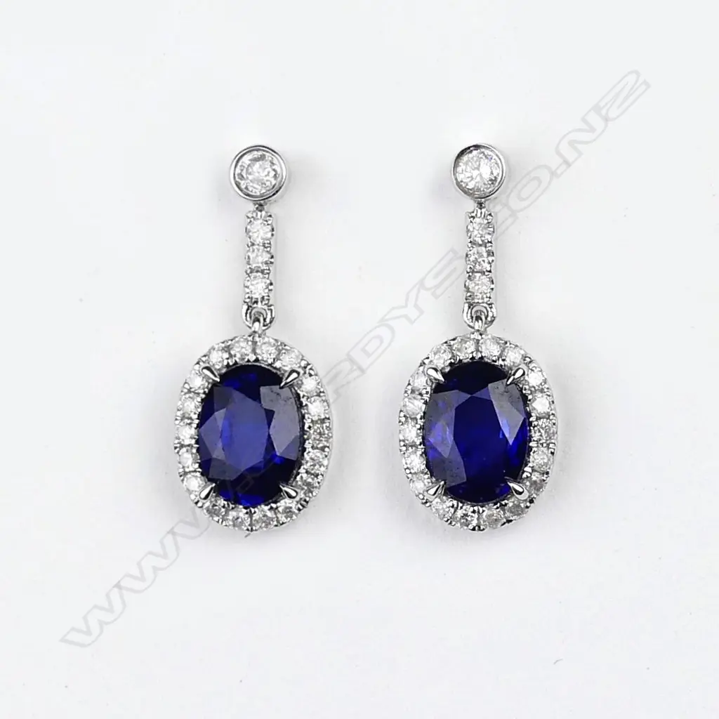A pair of 14ct white gold sapphire and diamond drop earrings Image 1++