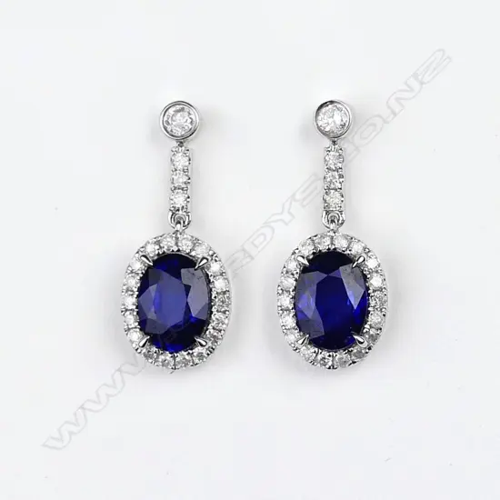 A pair of 14ct white gold sapphire and diamond drop earrings