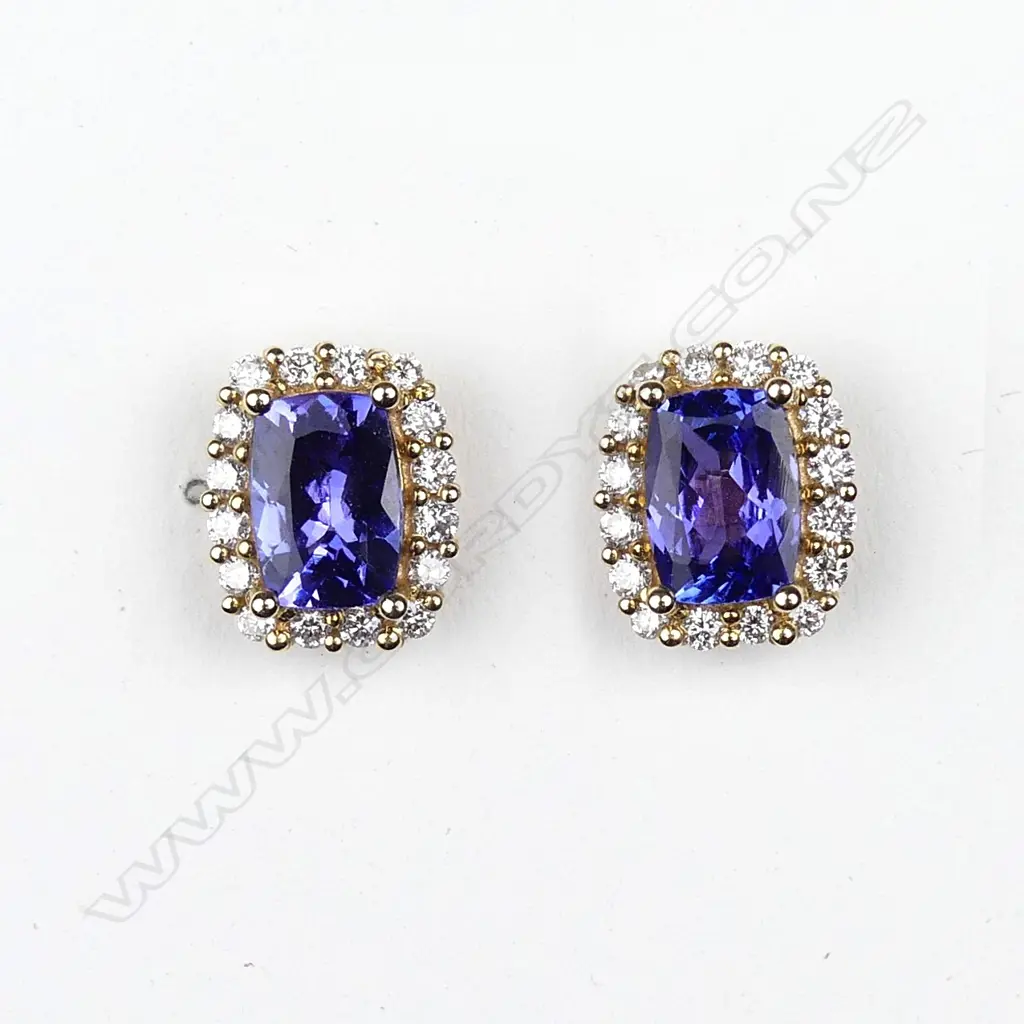 A pair of 14ct yellow gold tanzanite and diamond stud earrings Image 1++