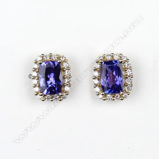 A pair of 14ct yellow gold tanzanite and diamond stud earrings