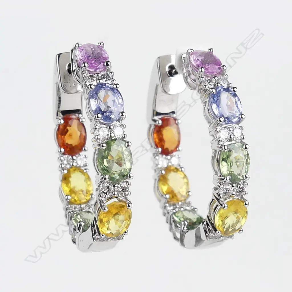 A pair of 14ct white gold sapphire and diamond hoop earrings Image 1++