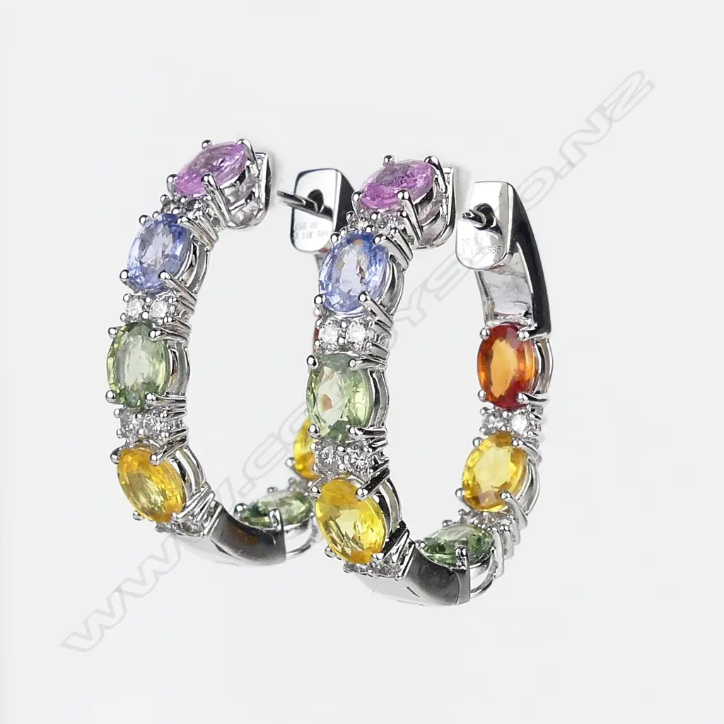A pair of 14ct white gold sapphire and diamond hoop earrings Image 1++