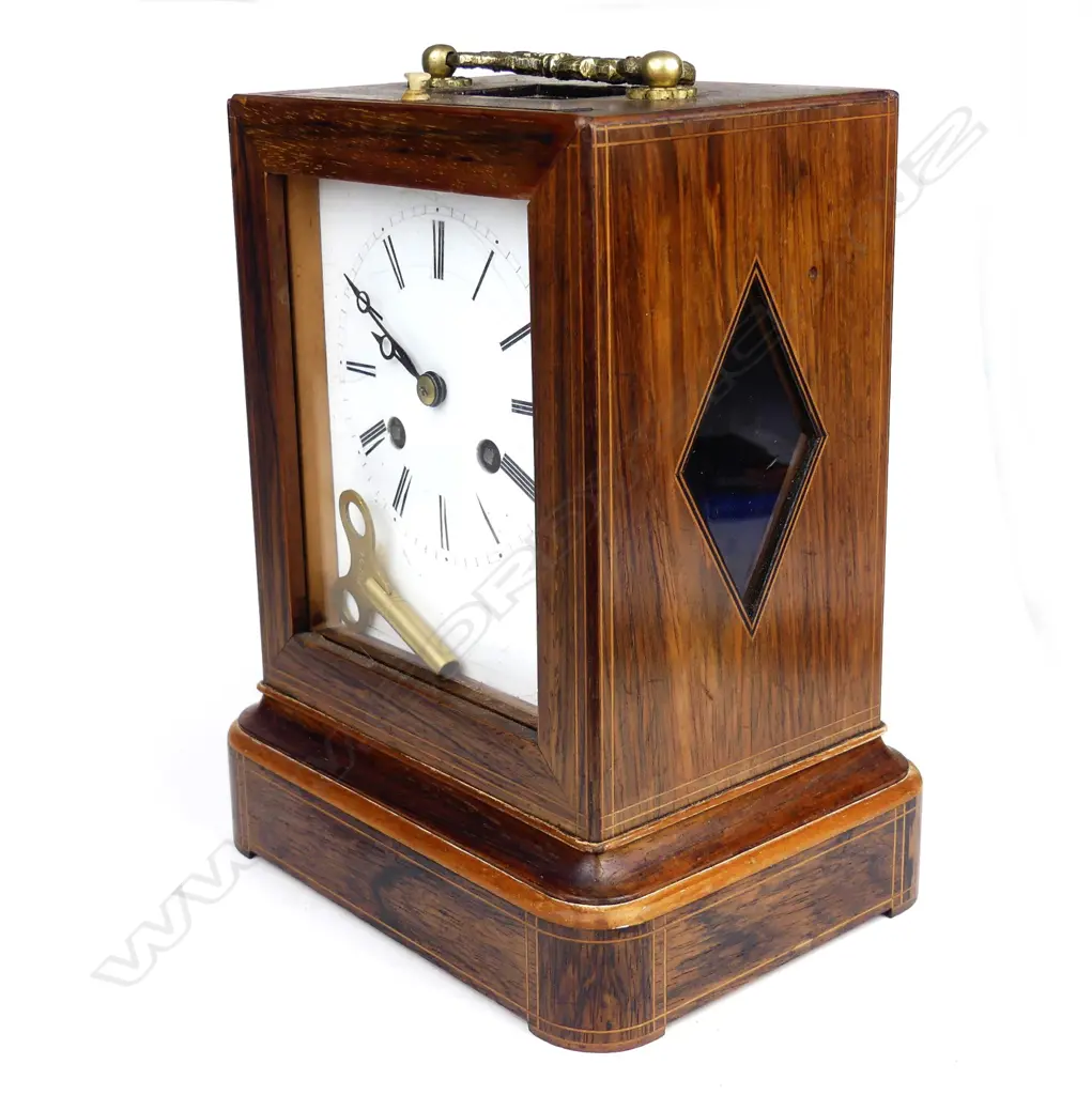 A rosewood cased mantel clock Image 1++
