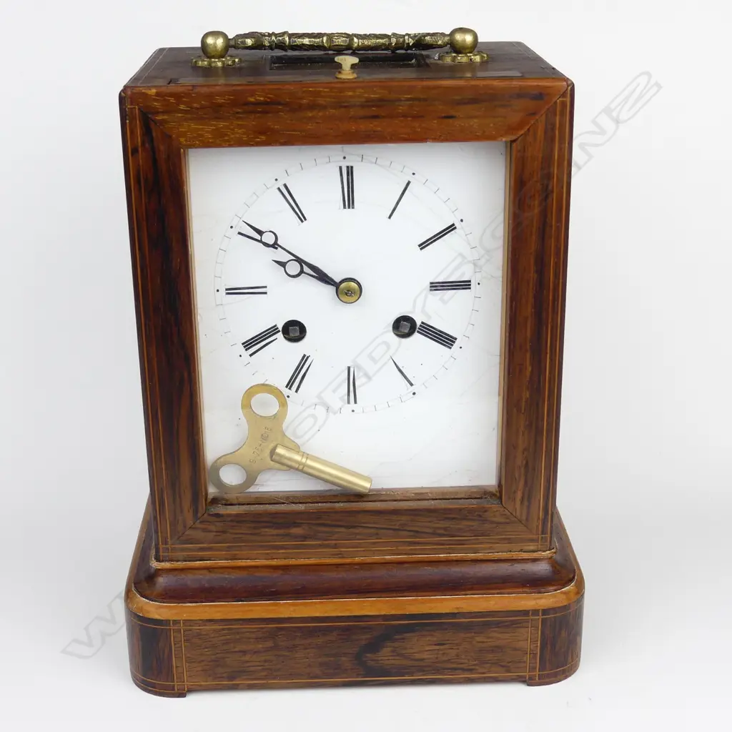 A rosewood cased mantel clock Image 1++