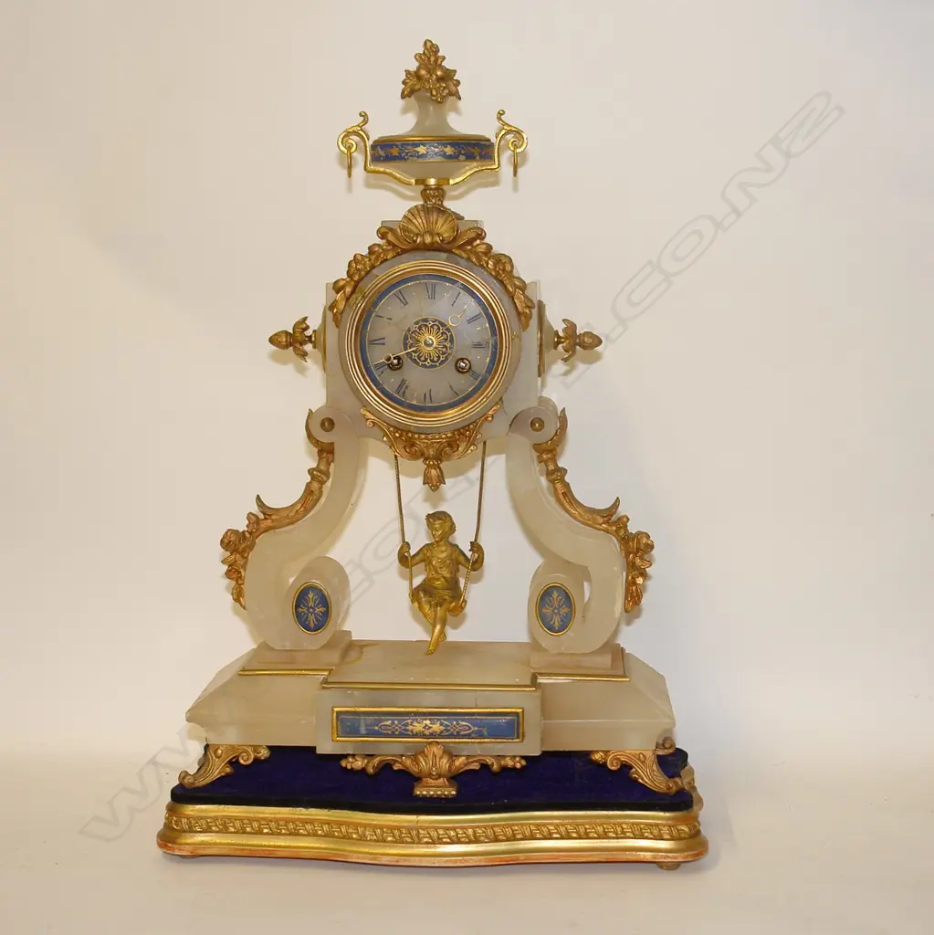 A 19thC French alabaster and ormolu lady on a swing boudoir clock Image 1++