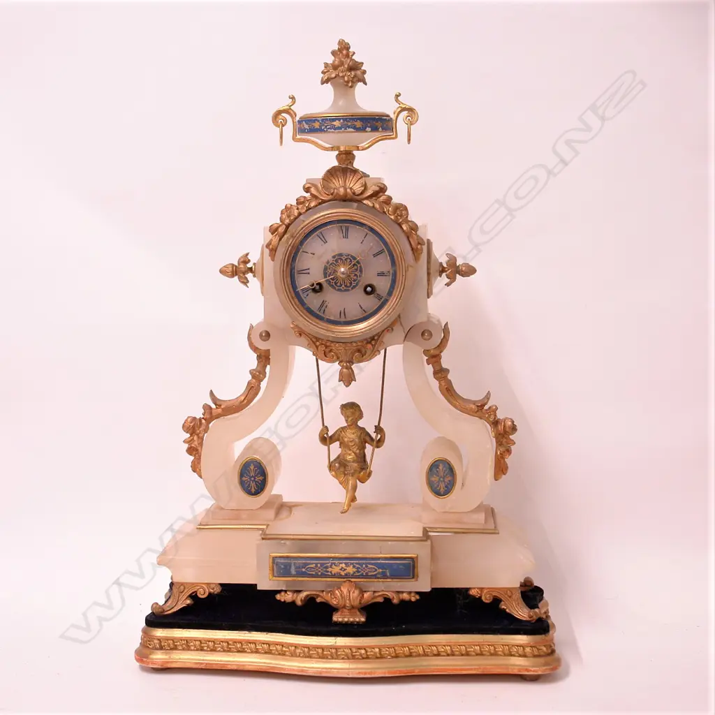 A 19thC French alabaster and ormolu lady on a swing boudoir clock Image 1++