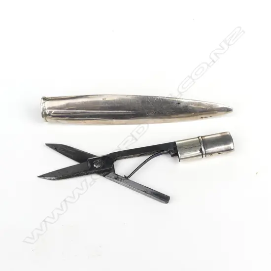 An Edwardian silver cased pair of travelling scissors