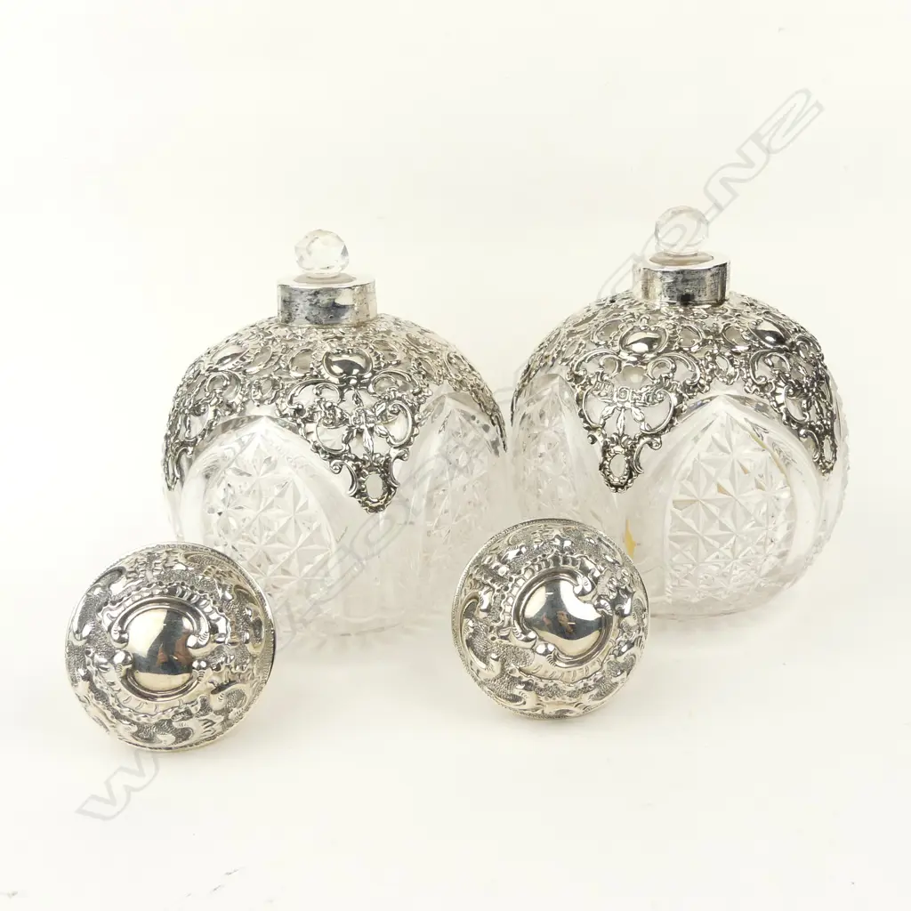 A pair of impressive Edwardian silver topped crystal scent bottles Image 1++