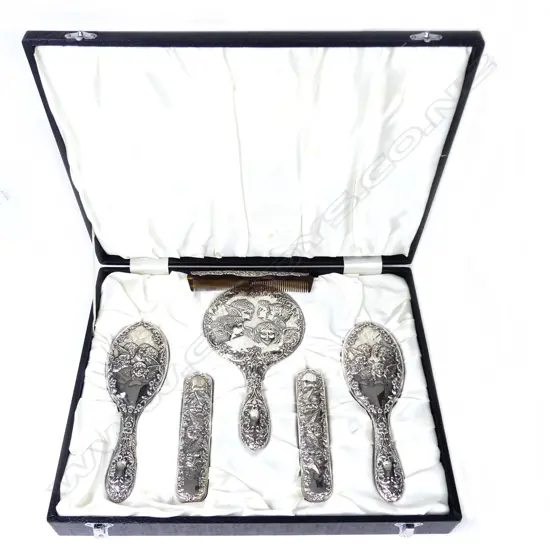 A silver dressing table set