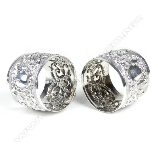 A pair of fancy Edwardian silver napkin rings