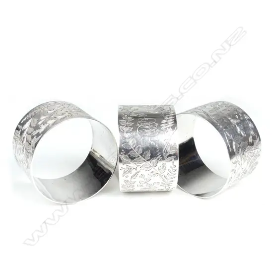 A set of three Victorian silver Arts & Crafts napkin rings