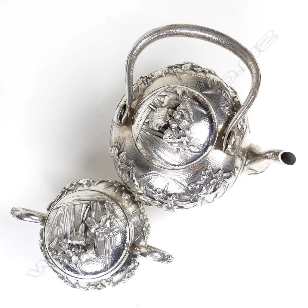 A Japanese Meiji iris decorated three-piece silver tea set Image 1++