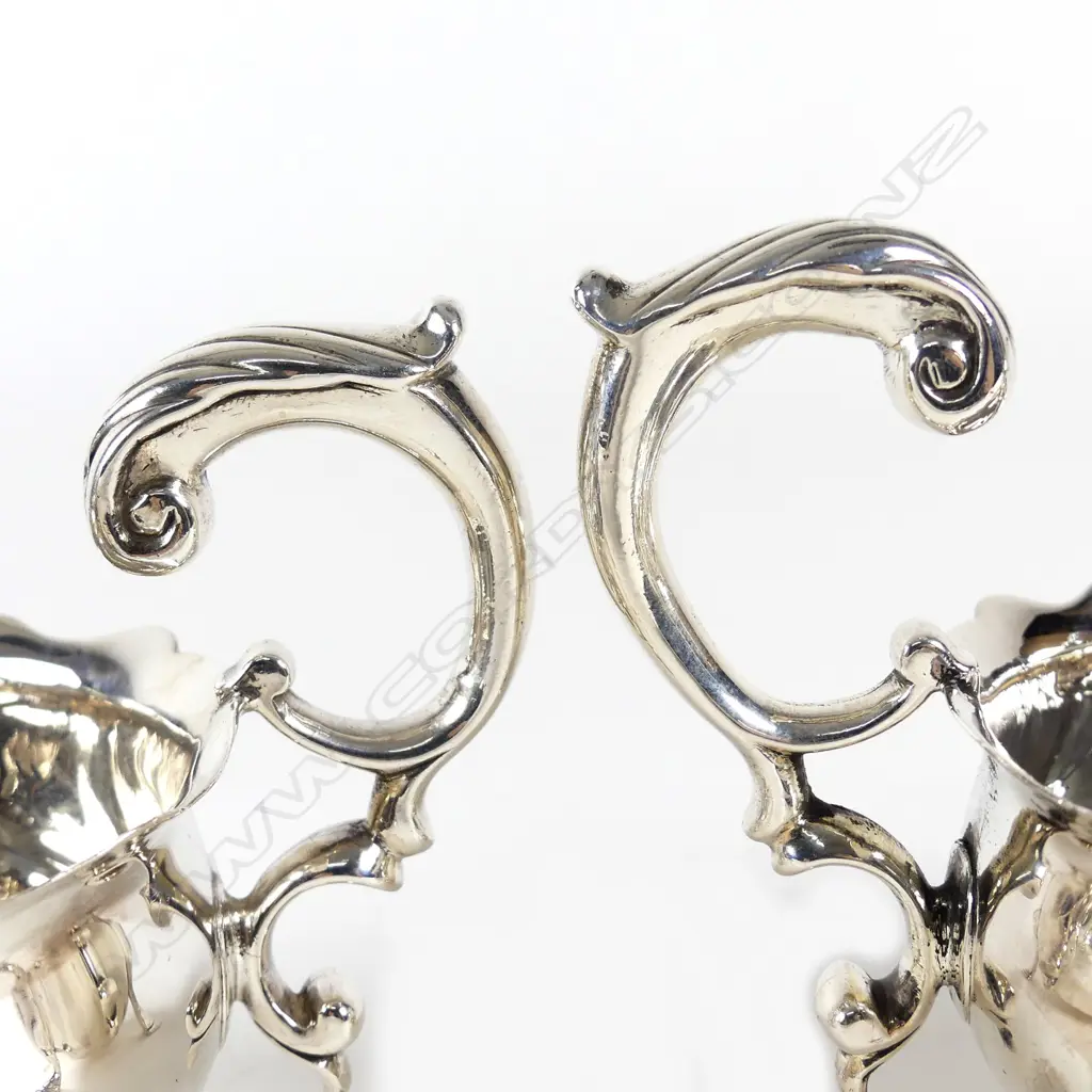 A rare pair of George II silver sauce boats Image 1++
