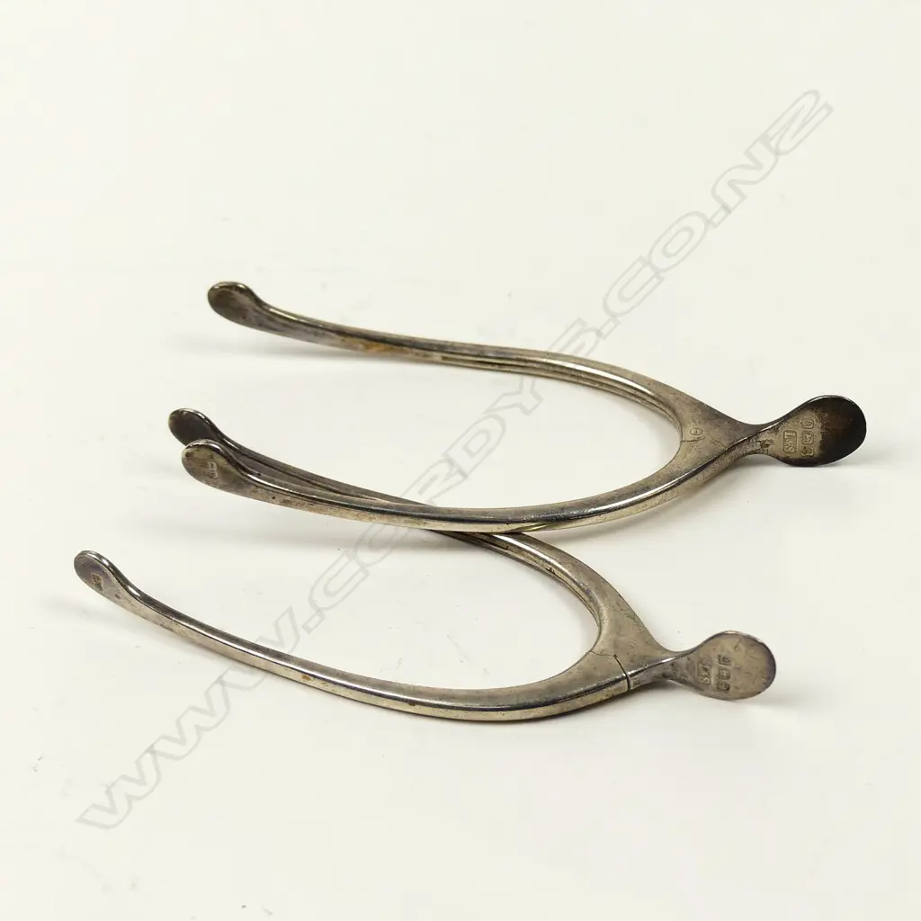 Two pair of silver wishbone sugar tongs Image 1++