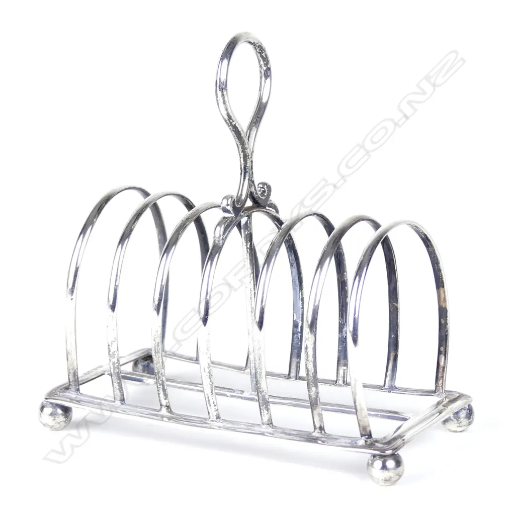 A Victorian George III heavy silver six slice toast rack Image 1++