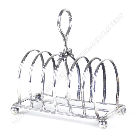 A Victorian George III heavy silver six slice toast rack