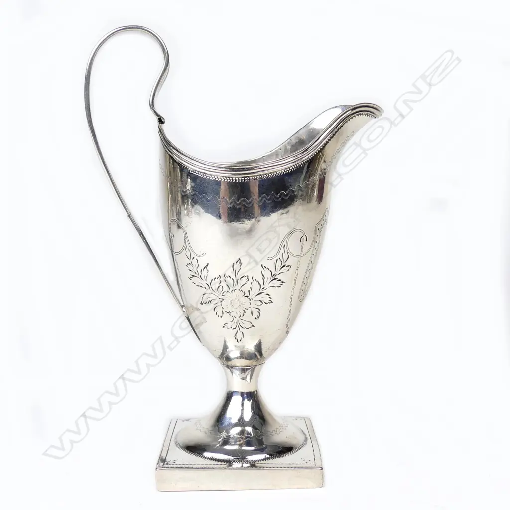 A George III silver helmet cream jug Image 1++