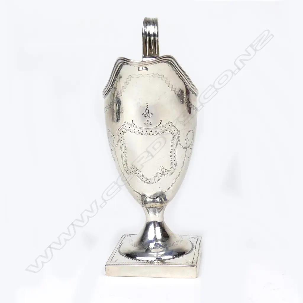 A George III silver helmet cream jug Image 1++