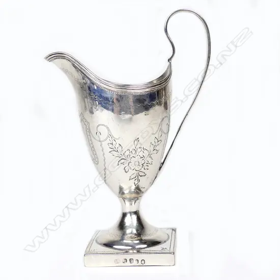 A George III silver helmet cream jug