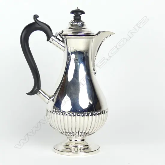 An elegant 1920s silver hot chocolate pot