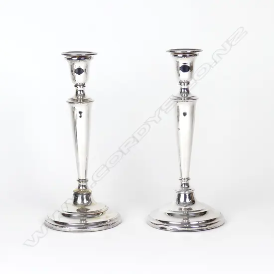 A pair of 19thC tall plain column candlesticks