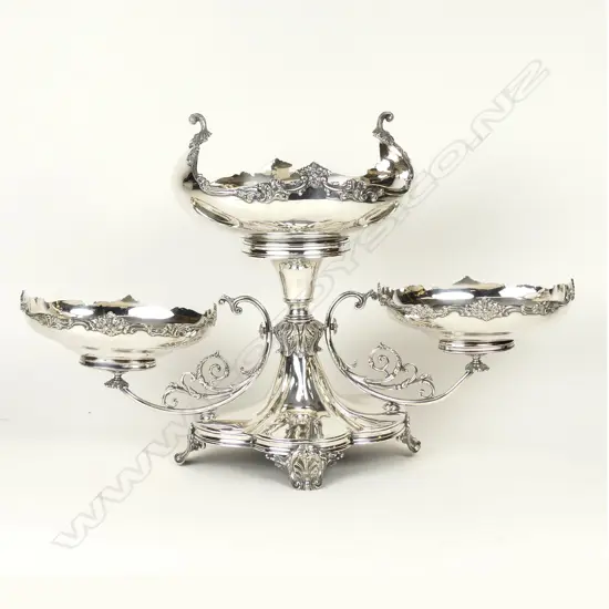 A large silver plate table centrepiece