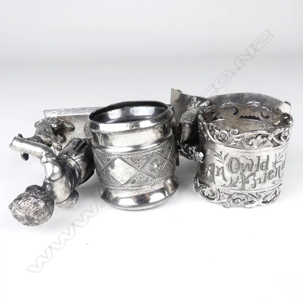Two late 19thC American Meriden figured silver plate napkin rings Image 1++