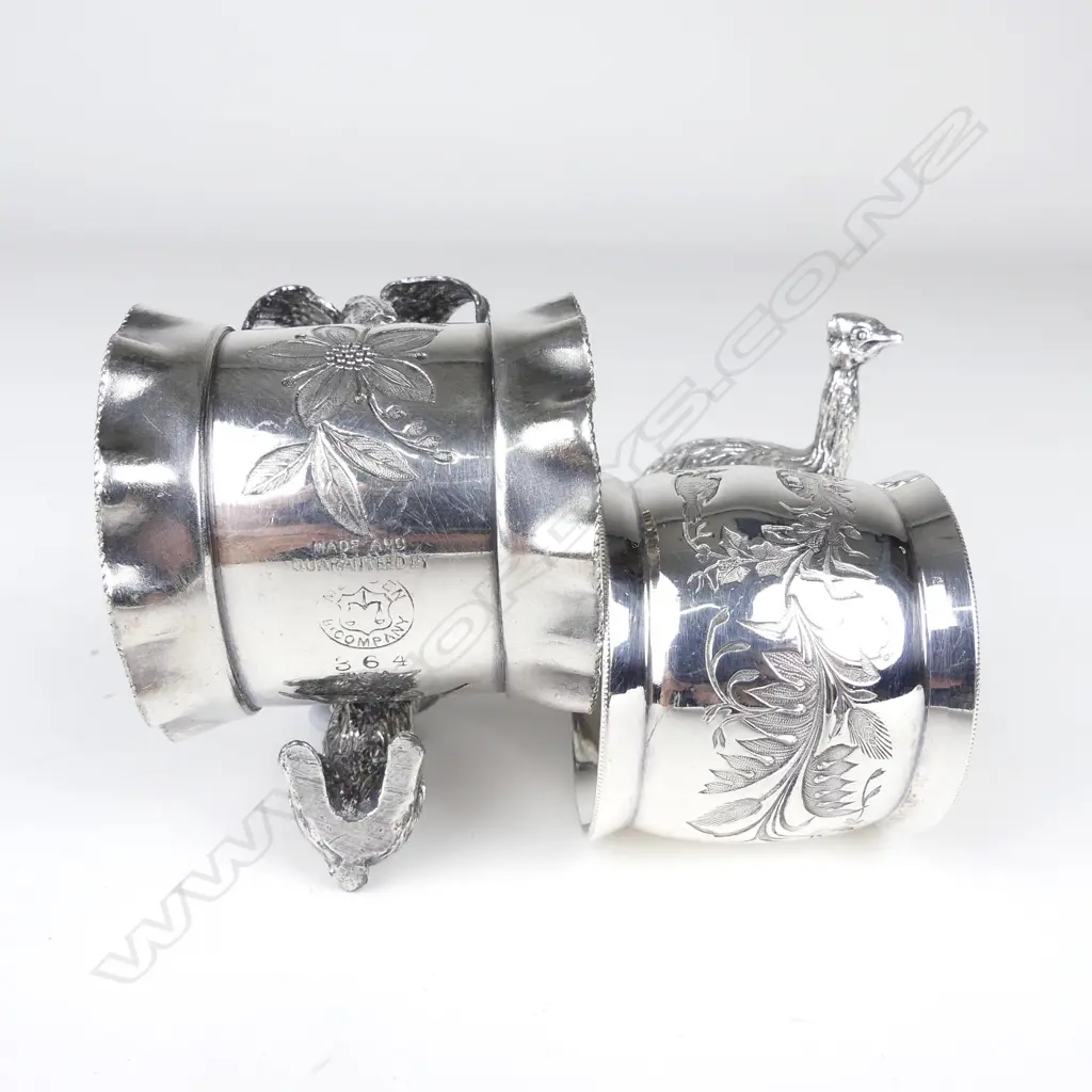 Two late 19thC American Meriden figured silver plate napkin rings Image 1++