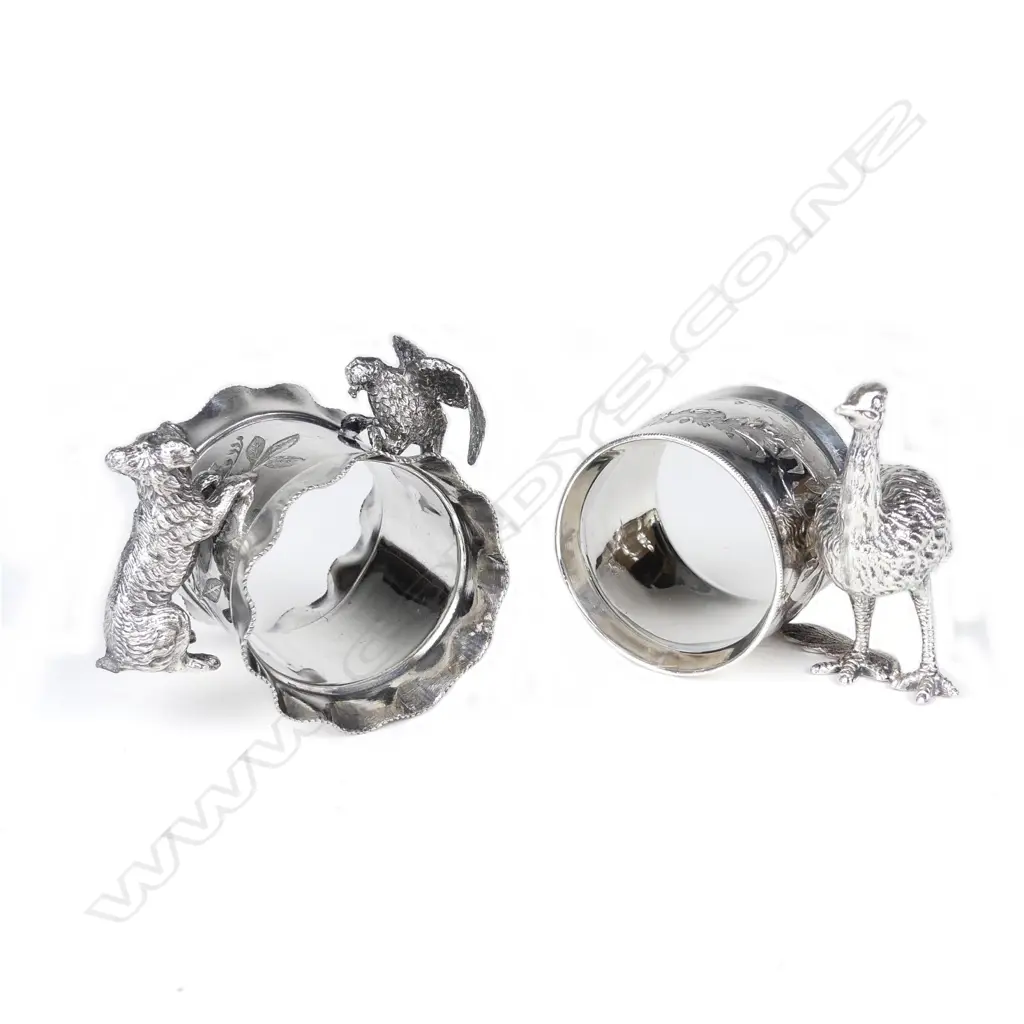 Two late 19thC American Meriden figured silver plate napkin rings Image 1++