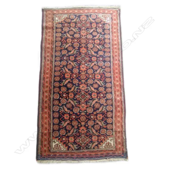 A semi-antique Baluchi all wool rug
