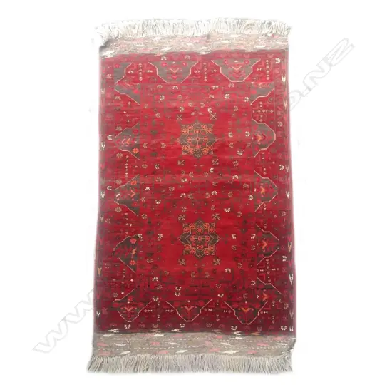 A small hand knotted Afghan rug