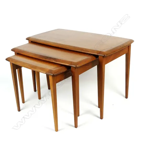 A nest of three Jon Jansen teak tables