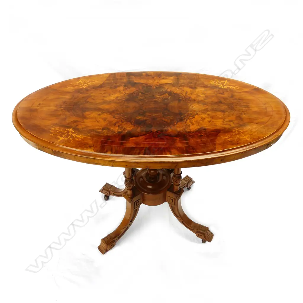 A Victorian walnut occasional table Image 1++