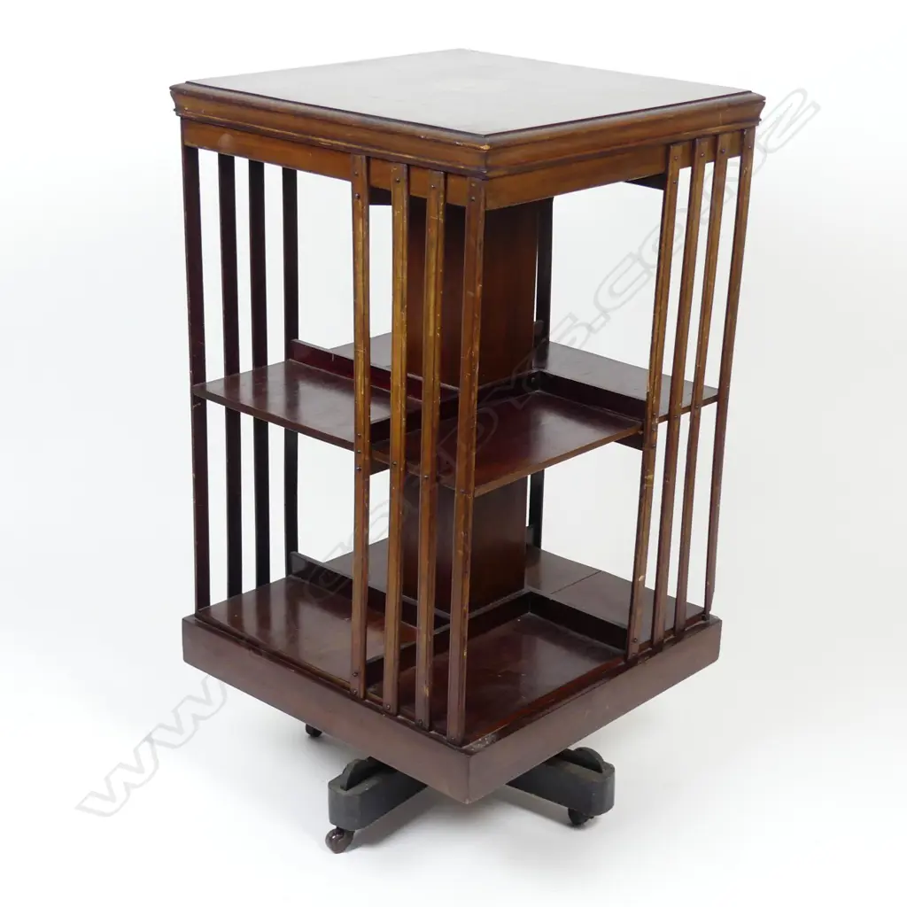 An Edwardian mahogany inlaid revolving bookcase Image 1++
