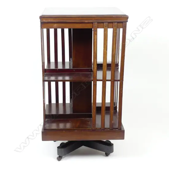 An Edwardian mahogany inlaid revolving bookcase