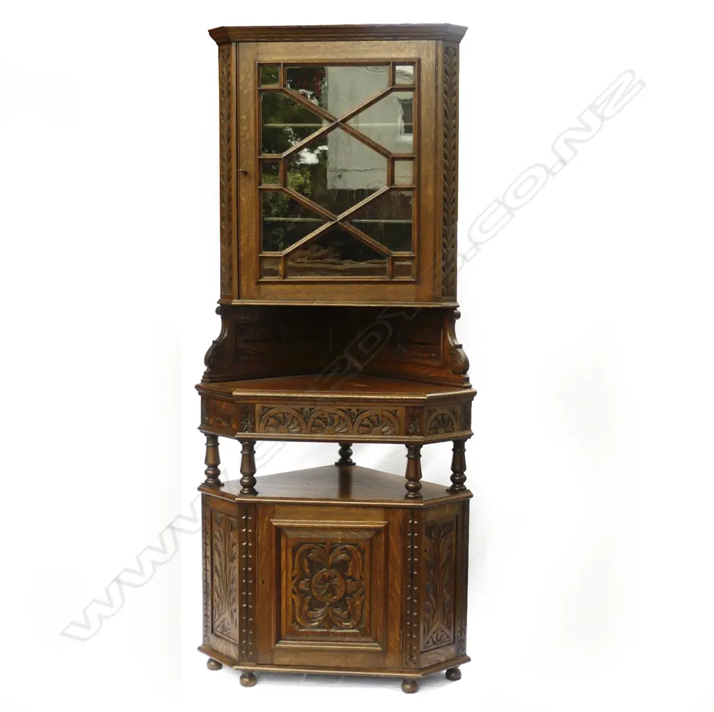 A carved oak corner cupboard Image 1++