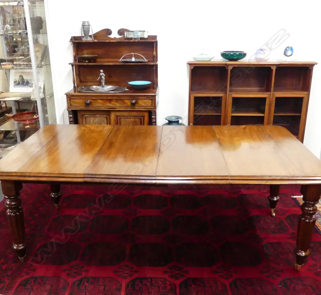 A Victorian mahogany crank extension dining table Image 1++