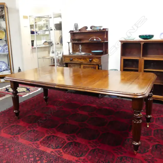 A Victorian mahogany crank extension dining table