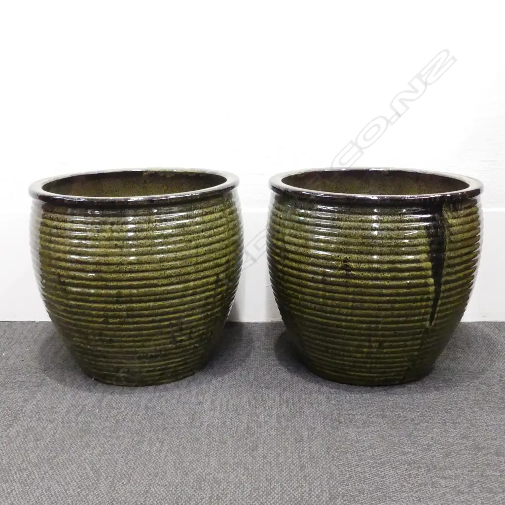A pair of large mottled green and black glazed garden pots Image 1++
