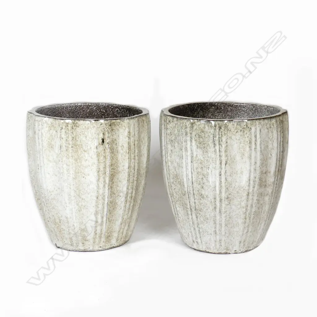 A pair of pale green and ivory mottled glazed garden pots Image 1++